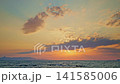 Golden Sunset Over Calm Ocean Waters 141585006
