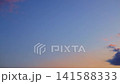 Airplane Journey Across Vibrant Sunset Sky 141588333