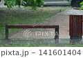 Heavy rain on a empty playground with a bench in summer. Horizontal video of a city street during the rain 141601404