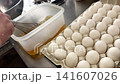 Preparing the rolled omelet: Bowl of dashi broth and preparation of eggs 141607026