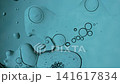 Oil drops floating on water surface creating a scientific and abstract macro background 141617834