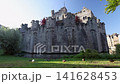 Gravensteen, a medieval castle in the city of Ghent in Belgium, Europe. Majestic Medieval Fortress with Moat and Ducks on Lush Green Grass, Historical European Castle 141628453