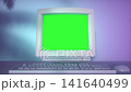 Retro Desktop Computer With Green Screen in Neon Studio Lighting 141640499