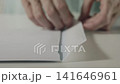 Closing a white envelope 141646961