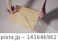 Opening envelope with  paper work 141646962