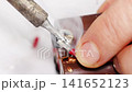 Repairing electronics with soldering techniques in a workshop 141652123