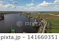 Drone shot of windmills in Zaanse Schans heritage park in Netherlands 141660351