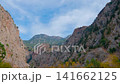 Timelapse: white clouds moving over Butterfly Valley cliffs near Fethiye 141662125