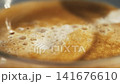 Freshly brewed coffee with foamed milk topping 141676610