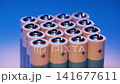 Several batteries neatly stacked in a vertical column 141677611