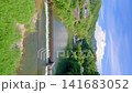 A cool summer scene by the river in Shionoe, Kagawa Prefecture, with towering cumulonimbus clouds floating in the blue sky. (Vertical video) 141683052
