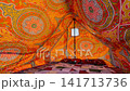 Interior View of Colorful Ornamental Arabic Bedouin Tent with Patterned Fabric Ceiling and Carpet in Sinai Egypt 141713736