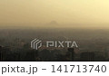 Aerial View of Giza at Sunset with Pyramid Silhouettes Visible on the Horizon 141713740