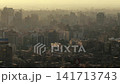 Aerial View of Greater Cairo Dense Cityscape at Dusk with Golden Haze 141713743