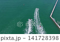 Aerial top view at vacation. Jet ski in motion. Summer vacation activity. Water sport activity in summer. Sea beach lifestyle. Beach life concept. Vacation on summer 141728398