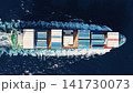 Shipping logistics. Commercial shipping. Cargo ship at sea, aerial top view. Freight container loaded on cargo tanker. Aerial cargo ship passing harbor. Cargo business. Container ship 141730073