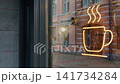 Glowing coffee cup neon sign reflected in cafe window with city street and blurred passerby 141734284