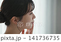 Young woman checking her skin condition 141736735