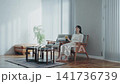 Young lady drinking tea 141736739