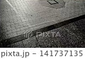 A monochrome silhouette of a person walking, in slow motion. 141737135