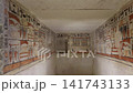Interior corridor of ancient Egyptian tomb with colorful hieroglyphic wall paintings and figures. Pharaoh burial chamber passage archaeological site Egypt. 141743133