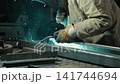 The welder is working. 141744694