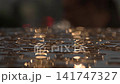 Sunset sunlight shines on transparent raindrops on a wooden surface, blurry background 141747327