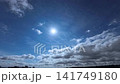 Clouds drifting by, illuminated by the rising sun. 141749180