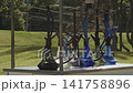 A row of glass hookahs stand on the counter of a street bar in the park 141758896
