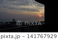Morning view of Hua Hin beach with golden sunrise, tranquil sea, and scenic coastal skyline, Thailand. 141767929