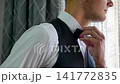 Business, hands shirt in home on bed with getting ready, dressing for work or morning routine in bedroom. Professional, man and employee with designer footwear in apartment for startup career 141772835