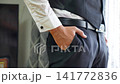 Business, hands and pockets home on bed with getting ready, dressing for work or morning routine in bedroom. Professional, man and employee with designer footwear in apartment for startup career 141772836
