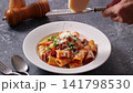 Adding Parmesan cheese to Bolognese - Slow motion 141798530