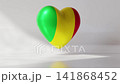 A 3D heart rotates slowly with the colors of Mali. The heart has sections of green, yellow, and red. It moves gracefully against a plain background that highlights its design 141868452