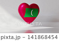 A heart shaped object displays the Maldives flag in a simple indoor area. The light reflects off the heart, creating an engaging look. The animation showcases the colors and design clearly 141868454