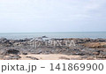 Scenic View of Rocky Seashore with Gentle Ocean Waves and Clear Sky At Lanta Island 141869900