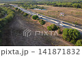 Carretera entre campos y bosques de la Costa Brava 141871832
