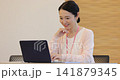 Business woman heading to PC at office Business woman heading to PC at office 141879345