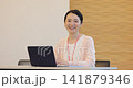 Business woman heading to PC at office Business woman heading to PC at office 141879346