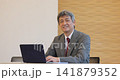 Senior man working on a computer Senior man working on a computer 141879352