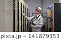 Senior male worker inspecting equipment in the boiler room Senior male worker inspecting equipment in the boiler room 141879353