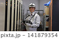 Senior male worker inspecting equipment in the boiler room Senior male worker inspecting equipment in the boiler room 141879354