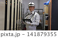 Senior male worker inspecting equipment in the boiler room Senior male worker inspecting equipment in the boiler room 141879355
