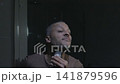 Barber Shaving Top of Head with Electric Clipper 141879596