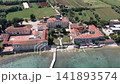 Aerial drone view of the historic abandoned Dajla monastery complex situated along the scenic Adriatic coast in Istria, Croatia. 141893574