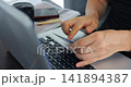 Business breakfast work. Individual managing digital payments in relaxed coffee shop setting. Person completing financial documentation while enjoying beverage at convenient cafe workspace 141894387