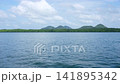 Panoramic View of Calm Blue Sea Ocean with Tropical Mountain Island and Cloudy Sky in Krabi 141895342