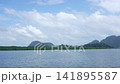 Panoramic View of Calm Blue Sea Ocean with Tropical Mountain Island and Cloudy Sky in Krabi 141895587