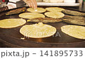 Mexican cook cooking traditional tortillas and tlacoyos 141895733