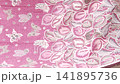 Pink floral butterfly fabric waving gently 141895736